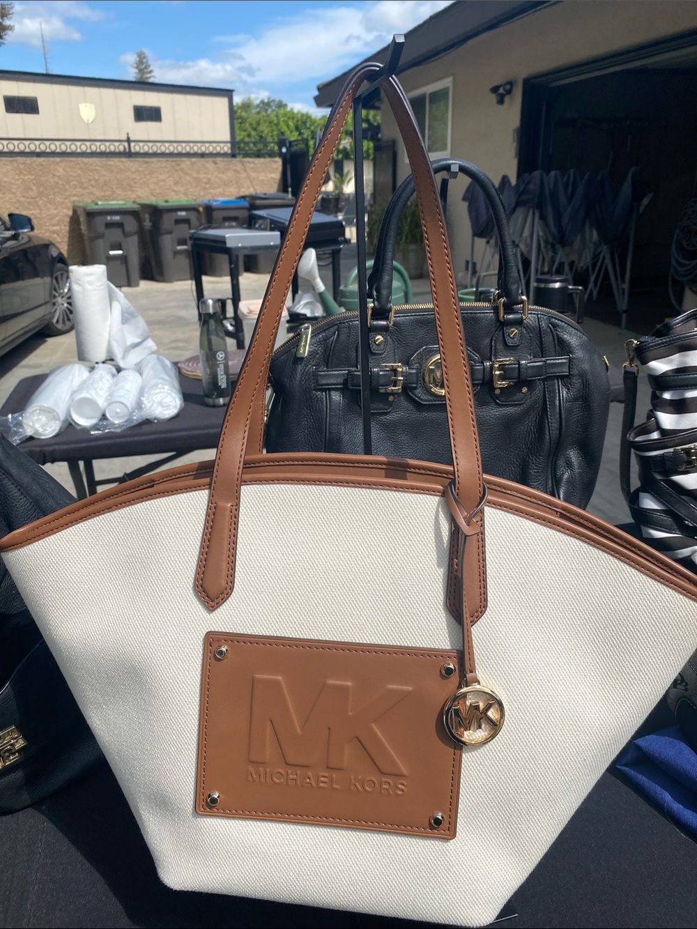 Michael Kors Cream Canvas Tote with Brown Trim and Gold Charm